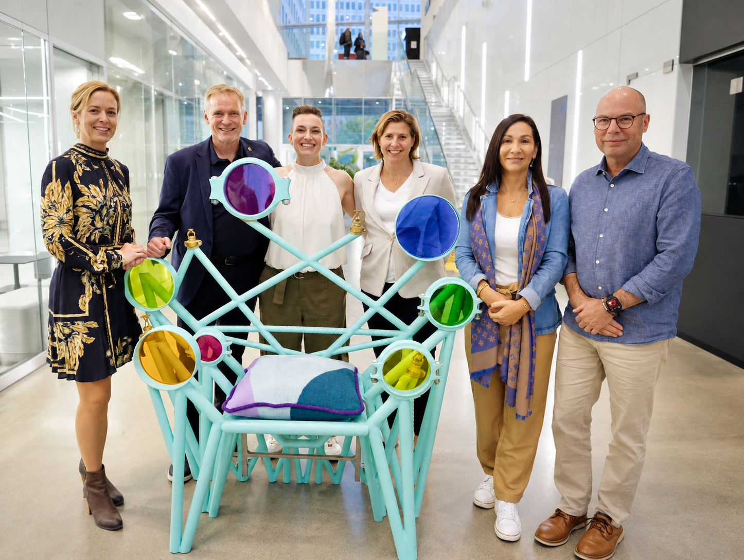 Team Portrait with a Colourful Sculptural Chair
